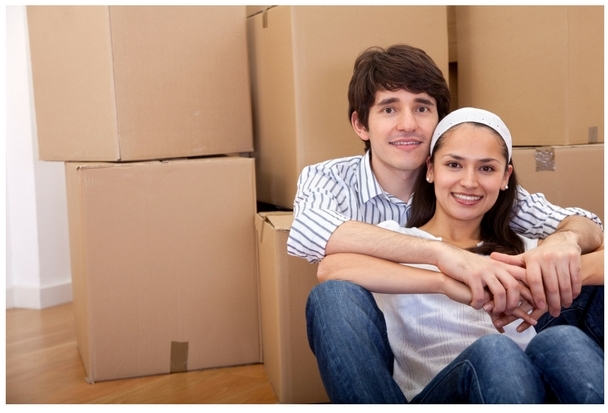 Image of Couple With Packed Moving Boxes